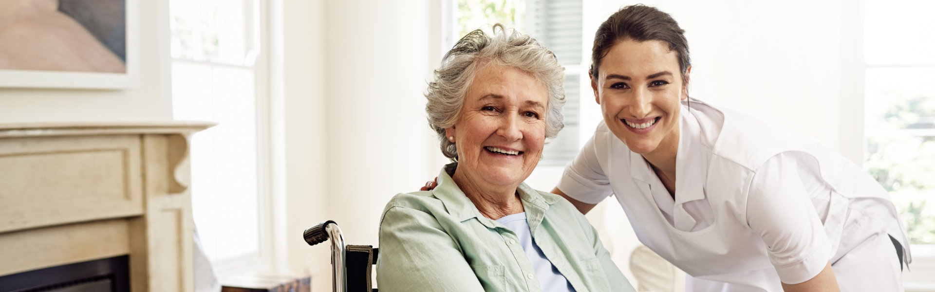 Nurse and patient smiling together during care